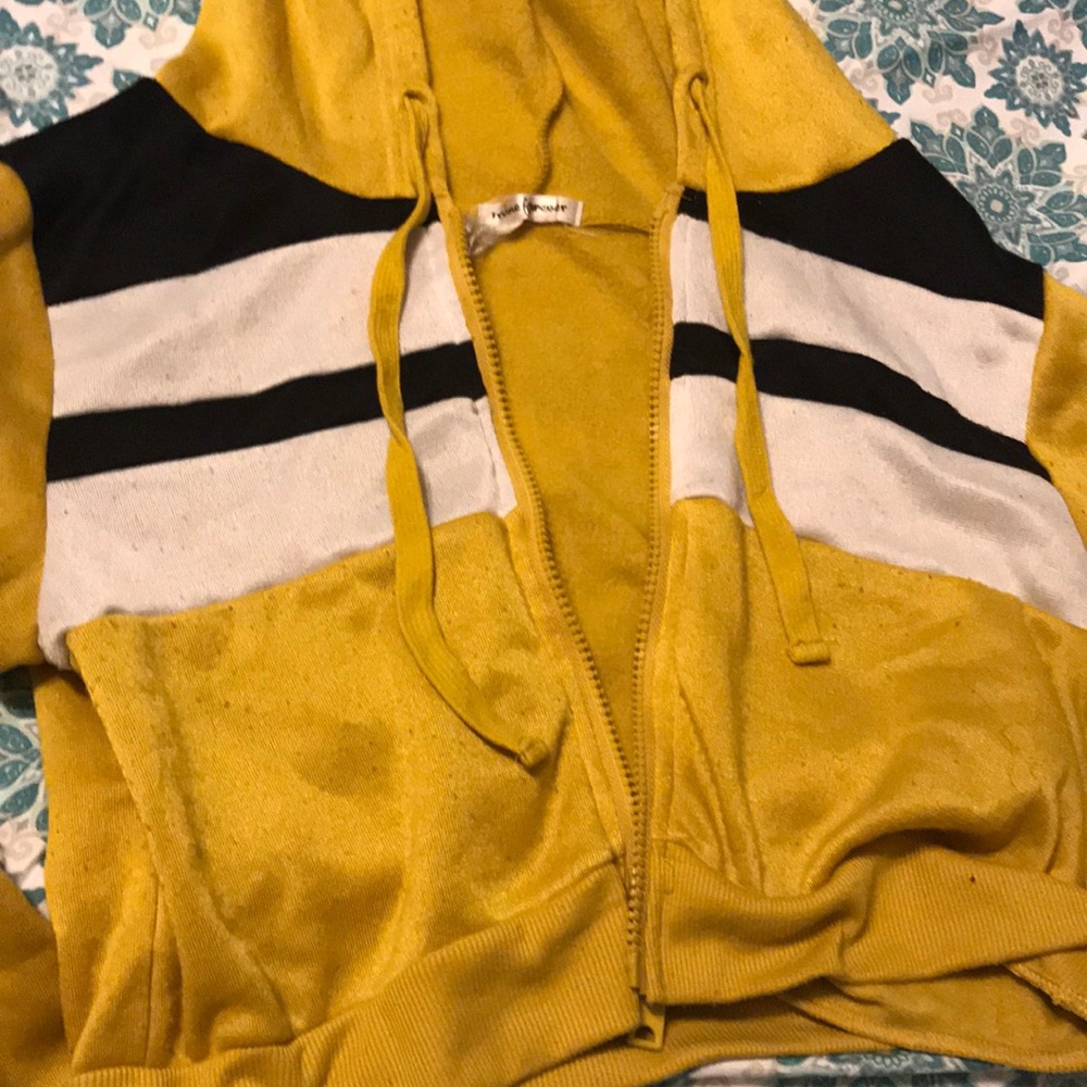 A blue and yellow and white crop top hoodie